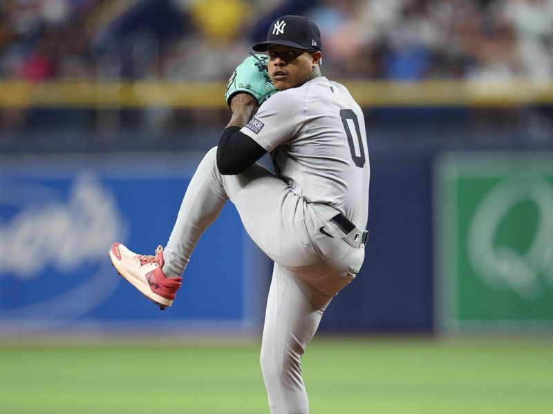 Jul 10, 2024; St. Petersburg, Florida, USA; New York Yankees pitcher Marcus Stroman (0) throws a pitch against the Tampa Bay Rays in the second inning at Tropicana Field. Mandatory Credit: Nathan Ray Seebeck-USA TODAY Sports