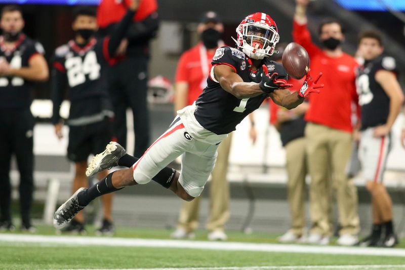 Jan 1, 2021; Atlanta, GA, USA; Georgia Bulldogs wide receiver George Pickens (1) catches a pass against the Cincinnati Bearcats in the first quarter of the Chick-fil-A Peach Bowl at Mercedes-Benz Stadium. Mandatory Credit: Brett Davis-USA TODAY Sports
