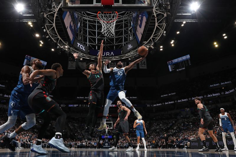 MINNEAPOLIS, MN -  APRIL 9: Mike Conley #10 of the Minnesota Timberwolves drives to the basket during the game against the Washington Wizards on April 9, 2024 at Target Center in Minneapolis, Minnesota. NOTE TO USER: User expressly acknowledges and agrees that, by downloading and or using this Photograph, user is consenting to the terms and conditions of the Getty Images License Agreement. Mandatory Copyright Notice: Copyright 2024 NBAE (Photo by Jordan Johnson/NBAE via Getty Images)