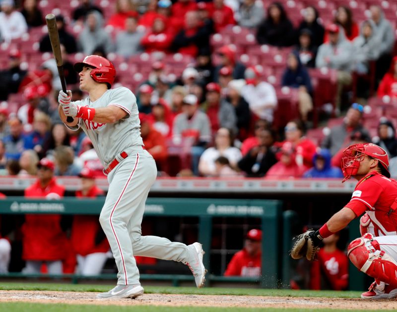 Apr 16, 2023; Cincinnati, Ohio, USA; Philadelphia Phillies catcher J.T. Realmuto (10) hits a solo home run against the Cincinnati Reds during the seventh inning at Great American Ball Park. Mandatory Credit: David Kohl-USA TODAY Sports