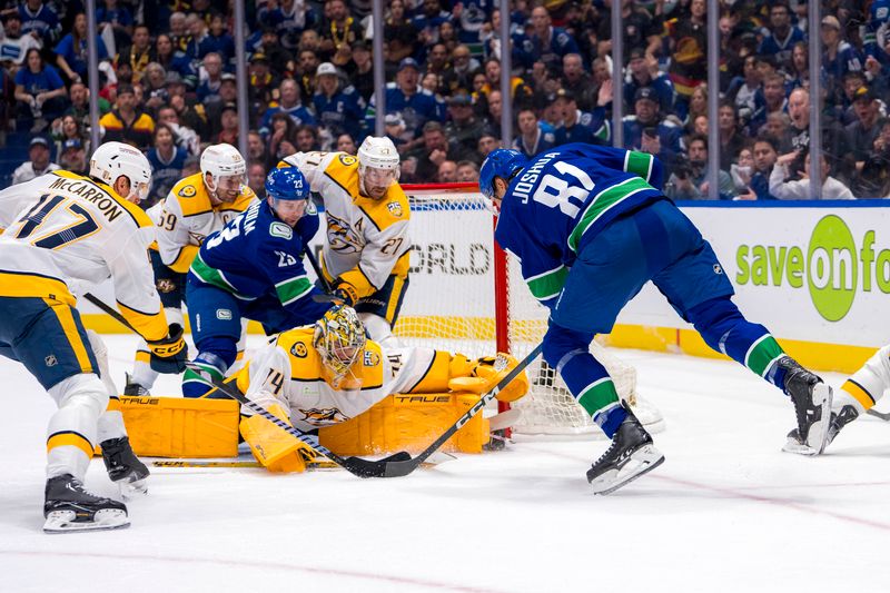 Apr 23, 2024; Vancouver, British Columbia, CAN; Nashville Predators goalie Juuse Saros (74) makes a save on Vancouver Canucks forward Dakota Joshua (81) during the third period in game two of the first round of the 2024 Stanley Cup Playoffs at Rogers Arena. Mandatory Credit: Bob Frid-USA TODAY Sports