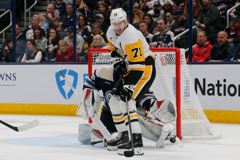 Nov 15, 2024; Columbus, Ohio, USA; Columbus Blue Jackets goalie Elvis Merzlikins (90) makes a save on the tip attempt of Pittsburgh Penguins center Evgeni Malkin (71) during the second period at Nationwide Arena. Mandatory Credit: Russell LaBounty-Imagn Images