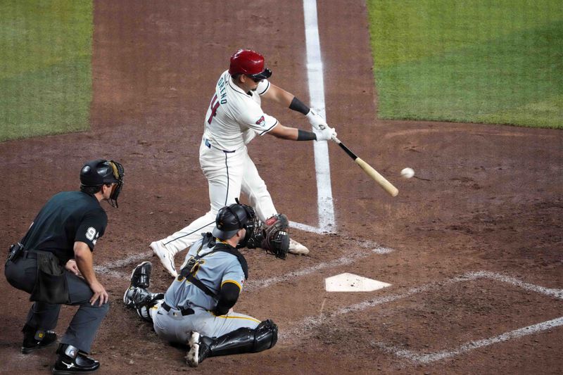 Jul 26, 2024; Phoenix, Arizona, USA; Arizona Diamondbacks catcher Gabriel Moreno (14) hits a two RBI single against the Pittsburgh Pirates during the sixth inning at Chase Field. Mandatory Credit: Joe Camporeale-USA TODAY Sports