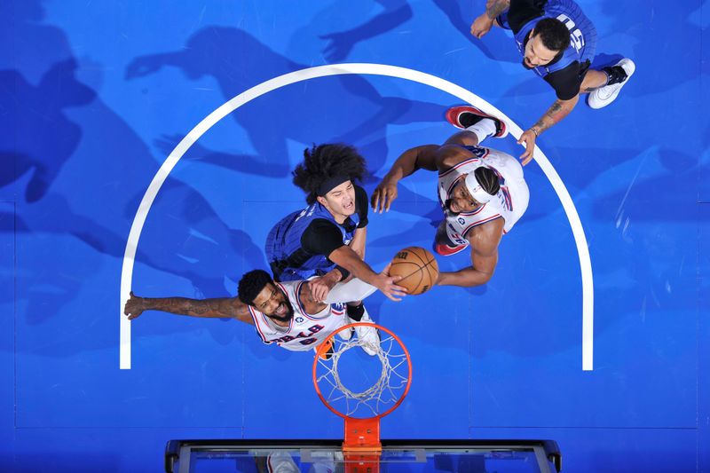 ORLANDO, FL - JANUARY 12: Anthony Black #0 of the Orlando Magic blocks the ball during the game against the Philadelphia 76ers on January 12, 2025 at Kia Center in Orlando, Florida. NOTE TO USER: User expressly acknowledges and agrees that, by downloading and or using this photograph, User is consenting to the terms and conditions of the Getty Images License Agreement. Mandatory Copyright Notice: Copyright 2025 NBAE (Photo by Fernando Medina/NBAE via Getty Images)