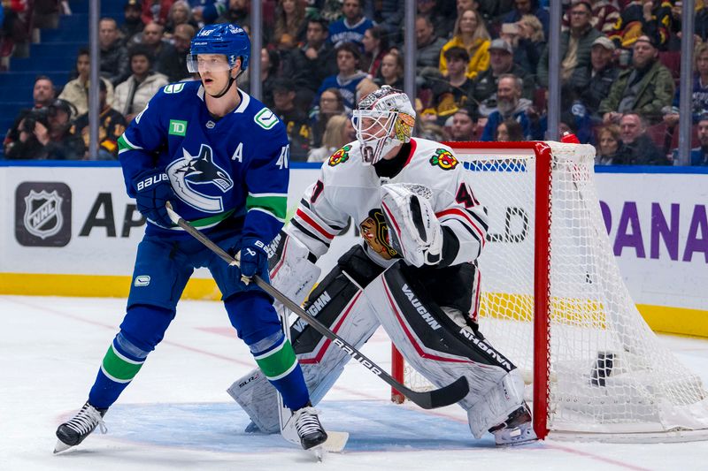 Nov 16, 2024; Vancouver, British Columbia, CAN; Vancouver Canucks forward Elias Pettersson (40) sets up in front of Chicago Blackhawks goalie Arvid Soderblom (40) during the third period at Rogers Arena. Mandatory Credit: Bob Frid-Imagn Images