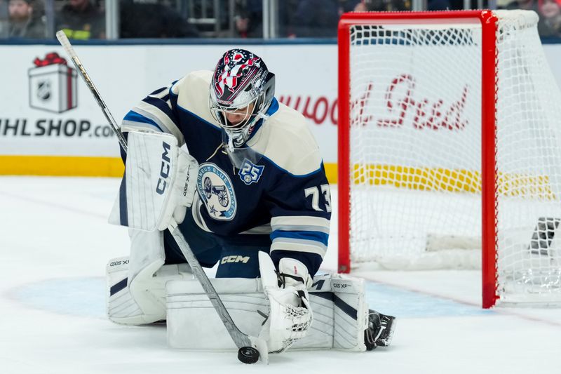 Nov 28, 2025; Columbus, Ohio, USA;  Columbus Blue Jackets goaltender Jet Greaves (73) makes a save in net against the Pittsburgh Penguins in the first period at Nationwide Arena. Mandatory Credit: Aaron Doster-Imagn Images
