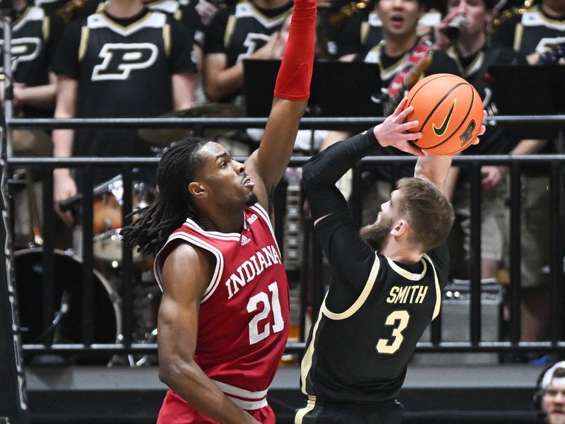 Jan 31, 2025; West Lafayette, Indiana, USA; Purdue Boilermakers guard Braden Smith (3) scores past Indiana Hoosiers forward Mackenzie Mgbako (21) during the first half at Mackey Arena. Mandatory Credit: Robert Goddin-Imagn Images