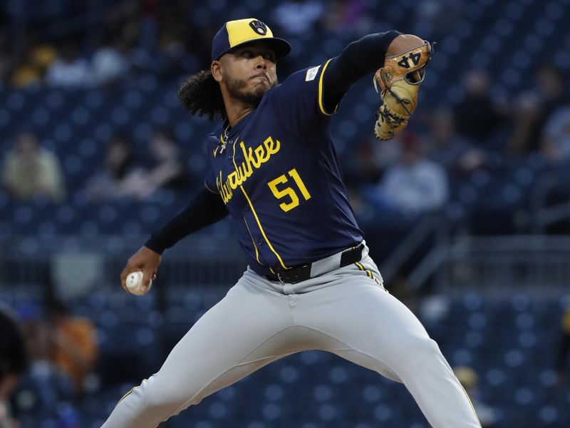 Sep 25, 2024; Pittsburgh, Pennsylvania, USA;  Milwaukee Brewers starting pitcher Freddy Peralta (51) delivers a pitch against the Pittsburgh Pirates during the first inning at PNC Park. Mandatory Credit: Charles LeClaire-Imagn Images