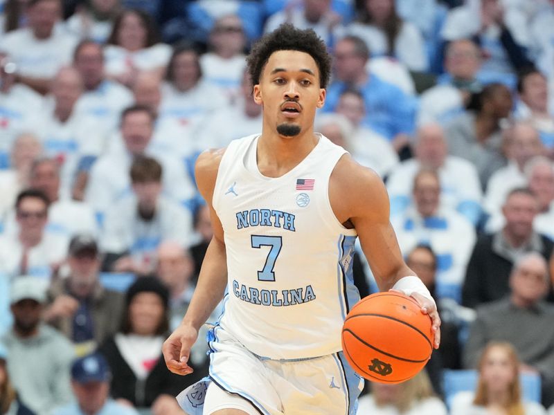 Feb 23, 2026; Chapel Hill, North Carolina, USA; North Carolina Tar Heels guard Seth Trimble (7) brings the ball up the court in the second half at Dean E. Smith Center. Mandatory Credit: Bob Donnan-Imagn Images