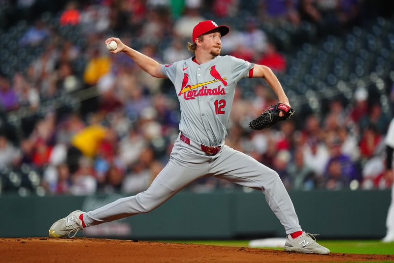 Sep 25, 2024; Denver, Colorado, USA; St. Louis Cardinals starting pitcher Erick Fedde (12) delivers a pitch in the first inning against the Colorado Rockies at Coors Field. Mandatory Credit: Ron Chenoy-Imagn Images