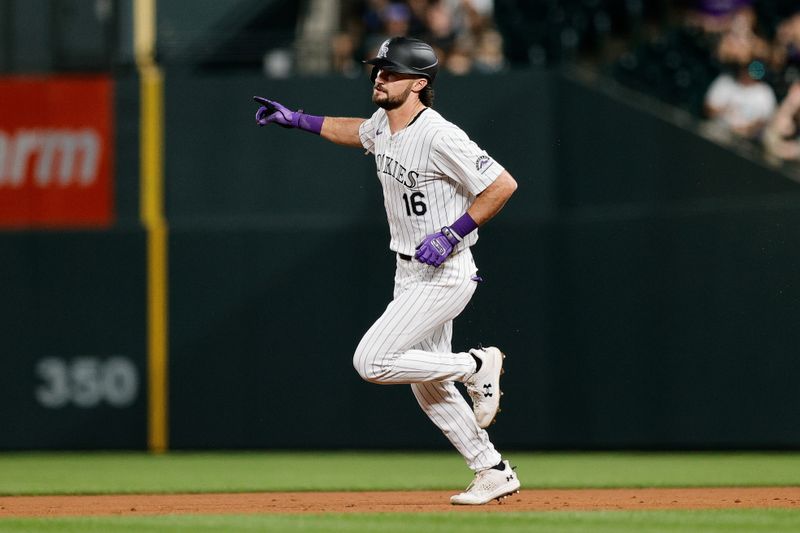 Aug 27, 2024; Denver, Colorado, USA; Colorado Rockies center fielder Sam Hilliard (16) gestures as he rounds the bases on a solo home run in the sixth inning against the Miami Marlins at Coors Field. Mandatory Credit: Isaiah J. Downing-USA TODAY Sports