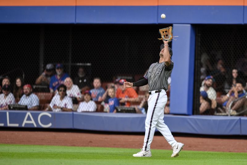 Jun 29, 2024; New York City, New York, USA; New York Mets outfielder Tyrone Taylor (15) catches a fly ball for an out during the seventh inning against the Houston Astros at Citi Field. Mandatory Credit: John Jones-USA TODAY Sports