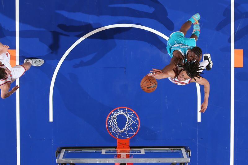 NEW YORK, NY - OCTOBER 15: Pacome Dadiet #4 of the New York Knicks drives to the basket during the game against the Charlotte Hornets during the 2024 NBA Preseason on October 15, 2024 at Madison Square Garden in New York City, New York.  NOTE TO USER: User expressly acknowledges and agrees that, by downloading and or using this photograph, User is consenting to the terms and conditions of the Getty Images License Agreement. Mandatory Copyright Notice: Copyright 2024 NBAE  (Photo by Nathaniel S. Butler/NBAE via Getty Images)