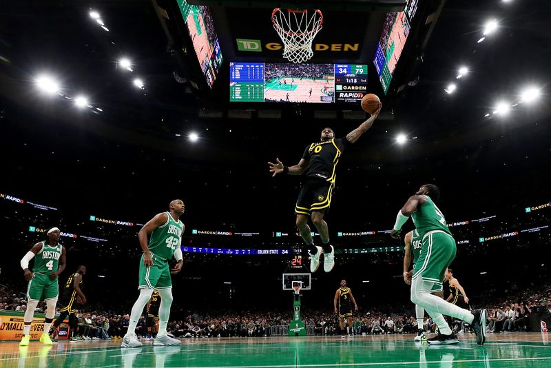 BOSTON, MASSACHUSETTS - MARCH 03: Gary Payton II #0 of the Golden State Warriors dunks the ball against the Boston Celtics at TD Garden on March 03, 2024 in Boston, Massachusetts. The Celtics defeat the Warriors 140-88. NOTE TO USER: User expressly acknowledges and agrees that, by downloading and or using this photograph, user is consenting to the terms and conditions of the Getty Images License Agreement.  (Photo by Maddie Meyer/Getty Images)