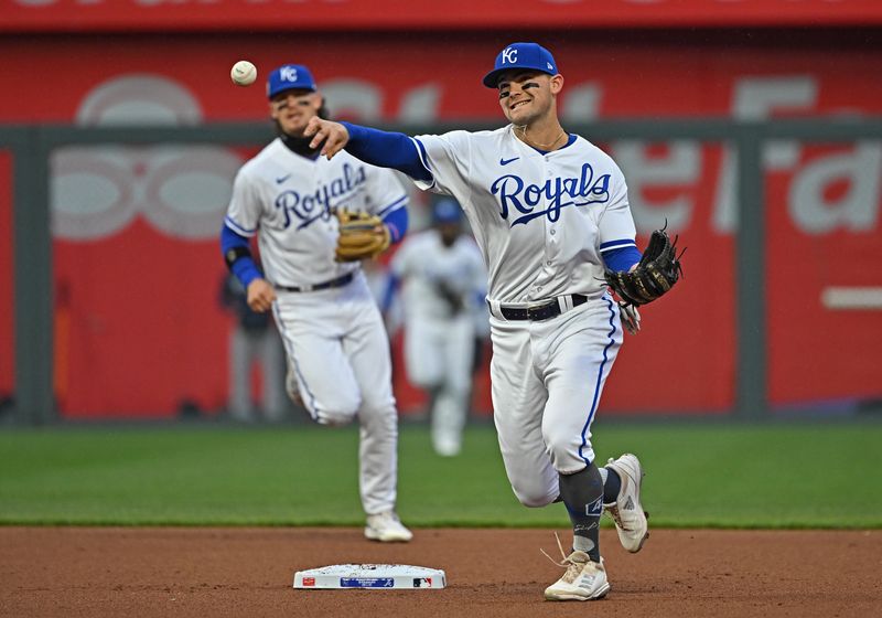 Apr 15, 2023; Kansas City, Missouri, USA;  Kansas City Royals second baseman Michael Massey (19) throws to first base for an out during the first inning against the Atlanta Braves at Kauffman Stadium. Mandatory Credit: Peter Aiken-USA TODAY Sports