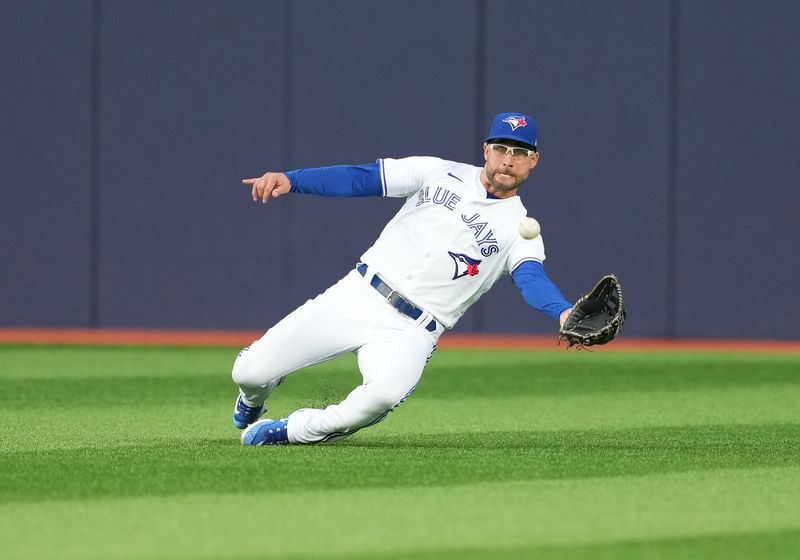 May 12, 2023; Toronto, Ontario, CAN; Toronto Blue Jays center fielder Kevin Kiermaier (39) catches a fly ball against the Atlanta Braves during the third inning at Rogers Centre. Mandatory Credit: Nick Turchiaro-USA TODAY Sports