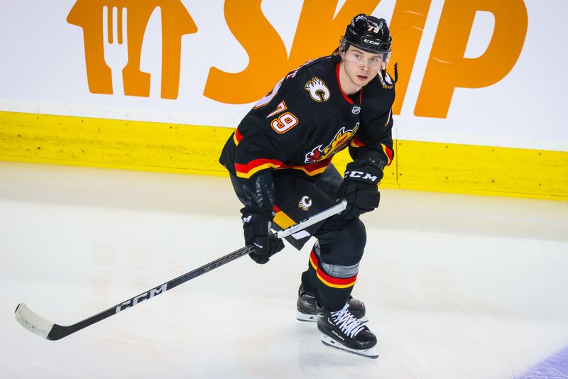 Jan 23, 2024; Calgary, Alberta, CAN; Calgary Flames right wing Cole Schwindt (79) skates during the warmup period against the St. Louis Blues at Scotiabank Saddledome. Mandatory Credit: Sergei Belski-USA TODAY Sports