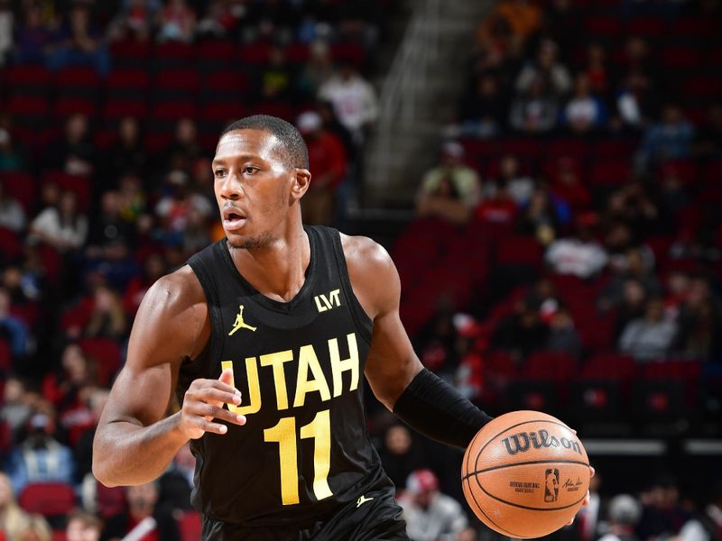 HOUSTON, TX - JANUARY 20: Kris Dunn #11 of the Utah Jazz dribbles the ball during the game against the Houston Rockets on January 20, 2024 at the Toyota Center in Houston, Texas. NOTE TO USER: User expressly acknowledges and agrees that, by downloading and or using this photograph, User is consenting to the terms and conditions of the Getty Images License Agreement. Mandatory Copyright Notice: Copyright 2024 NBAE (Photo by Logan Riely/NBAE via Getty Images)