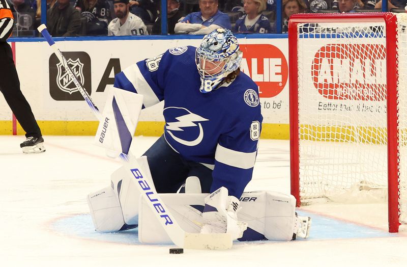 Apr 9, 2024; Tampa, Florida, USA; Tampa Bay Lightning goaltender Andrei Vasilevskiy (88) defends the puck against the Columbus Blue Jackets during the second period at Amalie Arena. Mandatory Credit: Kim Klement Neitzel-USA TODAY Sports