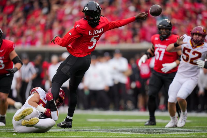 Oct 14, 2023; Cincinnati, Ohio, USA;  Cincinnati Bearcats quarterback Emory Jones (5) is hit by Iowa State Cyclones linebacker Caleb Bacon (50) as he throws in the first half at Nippert Stadium. Mandatory Credit: Aaron Doster-USA TODAY Sports