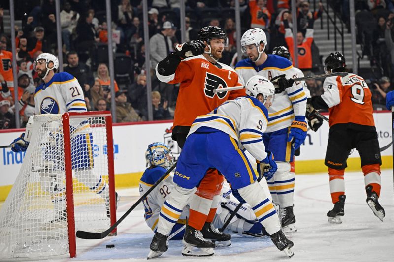 Dec 3, 2025; Philadelphia, Pennsylvania, USA; Philadelphia Flyers center Sean Couturier (14) celebrates goal by left wing Noah Cates (27) (not pictured) against the Buffalo Sabres during the second period at Xfinity Mobile Arena. Mandatory Credit: Eric Hartline-Imagn Images