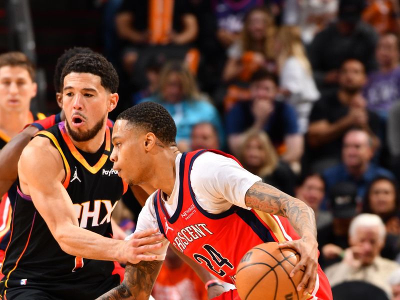 PHOENIX, AZ - FEBRUARY 28: Jordan Hawkins #24 of the New Orleans Pelicans dribbles the ball during the game against the Phoenix Suns on February 28, 2025 at PHX Arena in Phoenix, Arizona. NOTE TO USER: User expressly acknowledges and agrees that, by downloading and or using this photograph, user is consenting to the terms and conditions of the Getty Images License Agreement. Mandatory Copyright Notice: Copyright 2025 NBAE (Photo by Barry Gossage/NBAE via Getty Images)