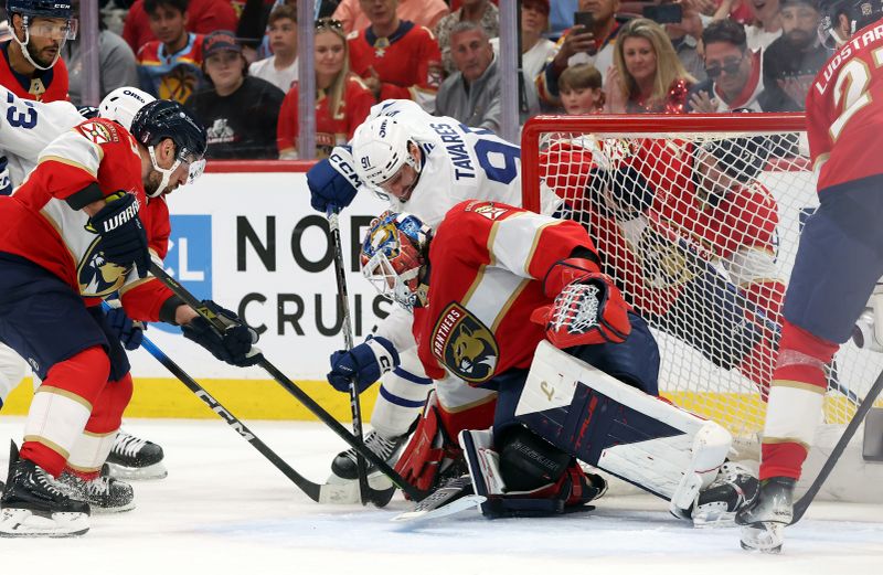 May 11, 2025; Sunrise, Florida, USA; Toronto Maple Leafs center John Tavares (91) shoots as Florida Panthers goaltender Sergei Bobrovsky (72) defends during the third period in game four of the second round of the 2025 Stanley Cup Playoffs at Amerant Bank Arena. Mandatory Credit: Kim Klement Neitzel-Imagn Images