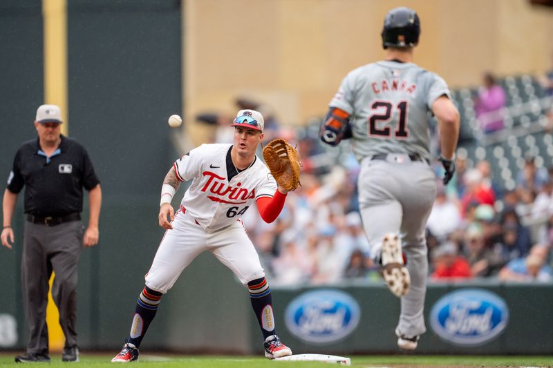 Jul 4, 2024; Minneapolis, Minnesota, USA; Minnesota Twins third baseman Jose Miranda (64) catches the ball retiring Detroit Tigers outfielder Mark Canha (21) in the first inning at Target Field. Mandatory Credit: Matt Blewett-USA TODAY Sports