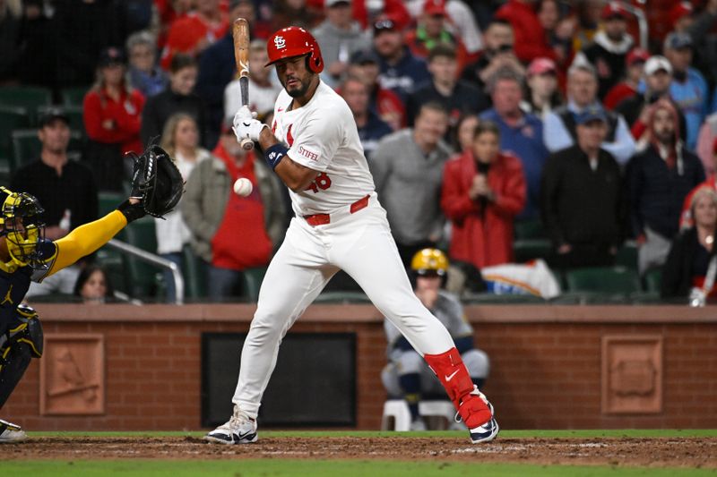 Apr 19, 2024; St. Louis, Missouri, USA; St. Louis Cardinals pinch hitter Ivan Herrera (48) gets hit by a pitch in the ninth inning against the Milwaukee Brewers at Busch Stadium. Mandatory Credit: Joe Puetz-USA TODAY Sports