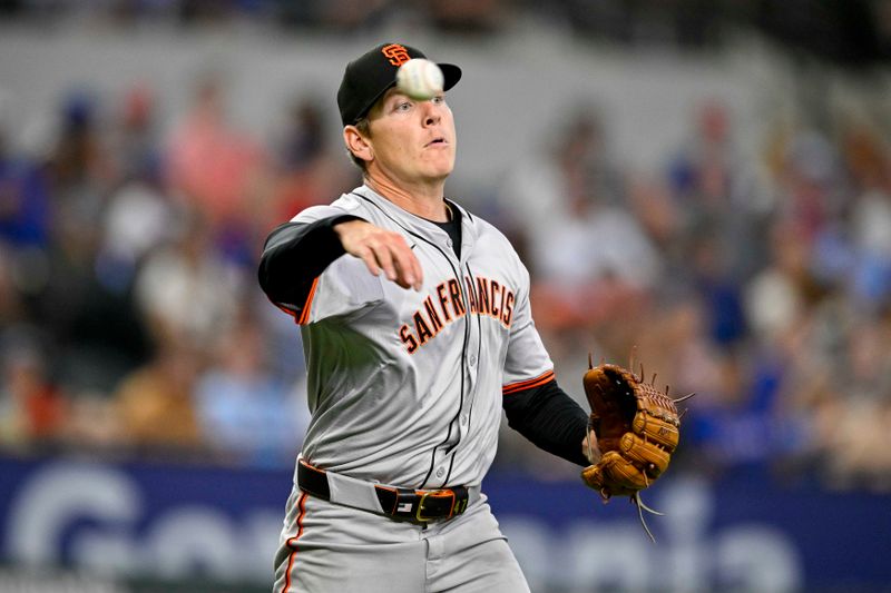 Jun 8, 2024; Arlington, Texas, USA; San Francisco Giants starting pitcher Spencer Howard (56) throws out Texas Rangers center fielder Leody Taveras (not pictured) at first base during the fifth inning at Globe Life Field. Mandatory Credit: Jerome Miron-USA TODAY Sports