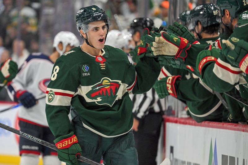 Oct 11, 2025; Saint Paul, Minnesota, USA;  Minnesota Wild defensemen Zeev Buium (8) celebrates his first career goal, a power play tally against the Columbus Blue Jackets during the third period at Grand Casino Arena. Mandatory Credit: Nick Wosika-Imagn Images