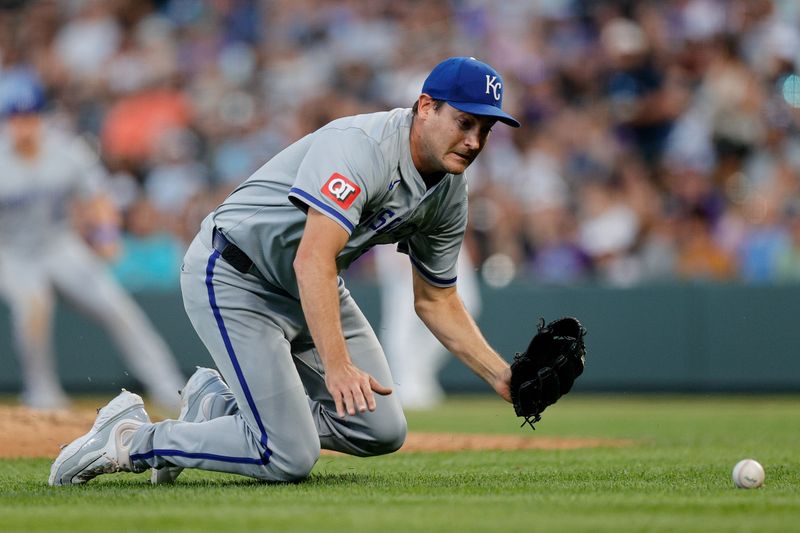 Jul 6, 2024; Denver, Colorado, USA; Kansas City Royals starting pitcher Seth Lugo (67) attempts to grab the ball in the fifth inning against the Colorado Rockies at Coors Field. Mandatory Credit: Isaiah J. Downing-USA TODAY Sports