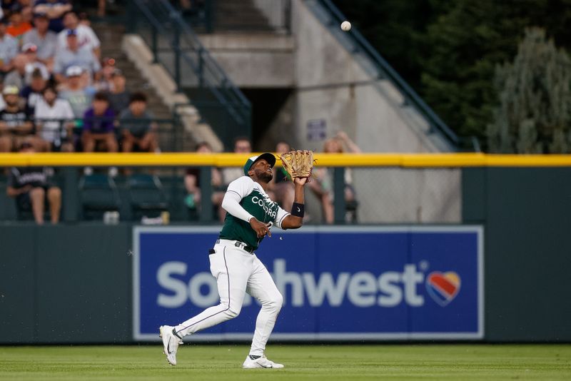 Jul 15, 2023; Denver, Colorado, USA; Colorado Rockies left fielder Jurickson Profar (29) makes a catch in the eighth inning against the New York Yankees at Coors Field. Mandatory Credit: Isaiah J. Downing-USA TODAY Sports