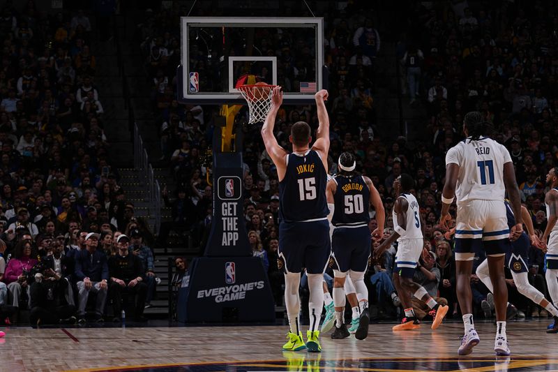 DENVER, CO - APRIL 10: Nikola Jokic #15 of the Denver Nuggets shoots a three point basket during the game against the Minnesota Timberwolves on April 10, 2024 at the Ball Arena in Denver, Colorado. NOTE TO USER: User expressly acknowledges and agrees that, by downloading and/or using this Photograph, user is consenting to the terms and conditions of the Getty Images License Agreement. Mandatory Copyright Notice: Copyright 2024 NBAE (Photo by Bart Young/NBAE via Getty Images)