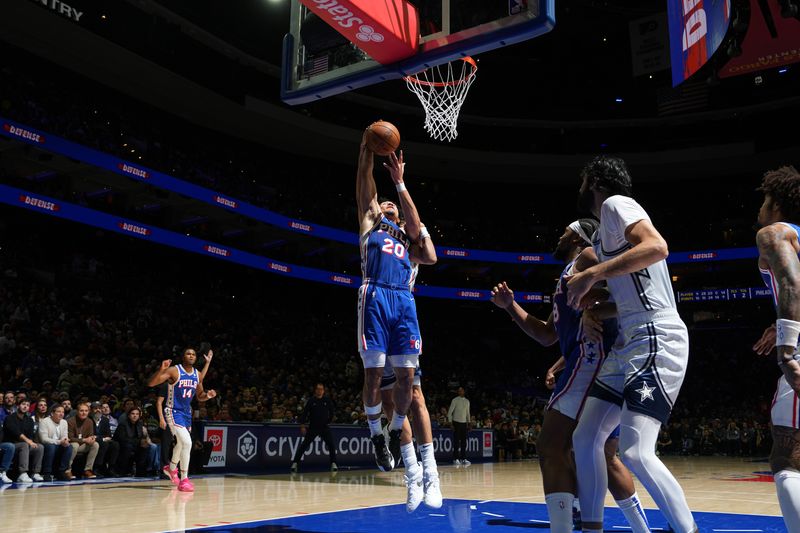 PHILADELPHIA, PA - DECEMBER 4: Jared McCain #20 of the Philadelphia 76ers drives to the basket during the game against the Orlando Magic on December 4, 2024 at the Wells Fargo Center in Philadelphia, Pennsylvania NOTE TO USER: User expressly acknowledges and agrees that, by downloading and/or using this Photograph, user is consenting to the terms and conditions of the Getty Images License Agreement. Mandatory Copyright Notice: Copyright 2024 NBAE (Photo by Jesse D. Garrabrant/NBAE via Getty Images)