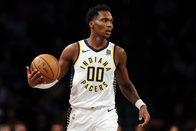 NEW YORK, NEW YORK - DECEMBER 04: Bennedict Mathurin #00 of the Indiana Pacers dribble during the first half against the Brooklyn Nets at Barclays Center on December 04, 2024 in the Brooklyn borough of New York City. NOTE TO USER: User expressly acknowledges and agrees that, by downloading and or using this photograph, User is consenting to the terms and conditions of the Getty Images License Agreement. (Photo by Sarah Stier/Getty Images)