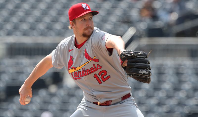 Apr 9, 2025; Pittsburgh, Pennsylvania, USA;  St. Louis Cardinals starting pitcher Erick Fedde (12) delivers a pitch against the Pittsburgh Pirates during the first inning at PNC Park. Mandatory Credit: Charles LeClaire-Imagn Images