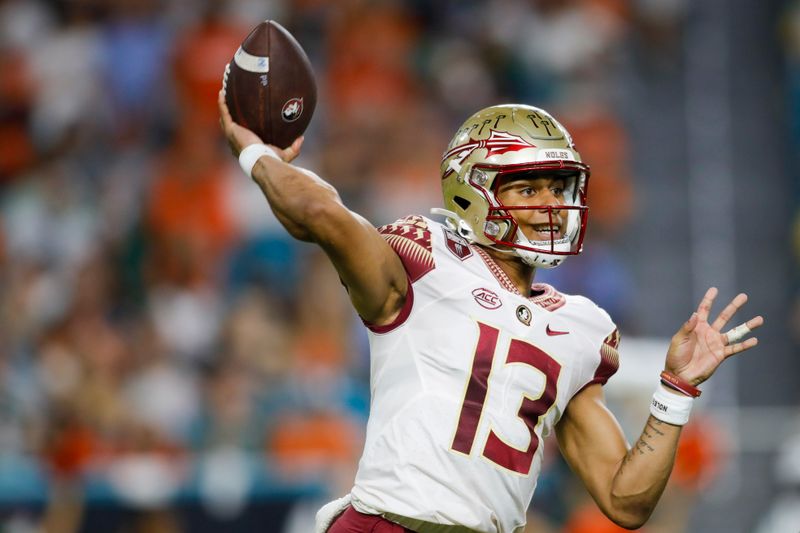 Nov 5, 2022; Miami Gardens, Florida, USA; Florida State Seminoles quarterback Jordan Travis (13) throws the football during the second quarter against the Miami Hurricanes at Hard Rock Stadium. Mandatory Credit: Sam Navarro-USA TODAY Sports