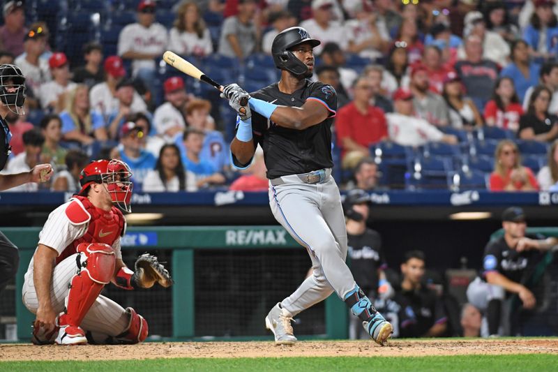 Aug 13, 2024; Philadelphia, Pennsylvania, USA; Miami Marlins outfielder Jesús Sánchez (12) watches his home run during the ninth inning against the Philadelphia Phillies at Citizens Bank Park. Mandatory Credit: Eric Hartline-USA TODAY Sports