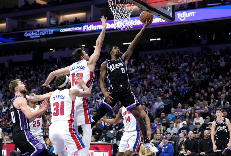 SACRAMENTO, CALIFORNIA - FEBRUARY 07: Malik Monk #0 of the Sacramento Kings shoots the ball against Danilo Gallinari #12 of the Detroit Pistons in the fourth quarter at Golden 1 Center on February 07, 2024 in Sacramento, California. NOTE TO USER: User expressly acknowledges and agrees that, by downloading and or using this photograph, User is consenting to the terms and conditions of the Getty Images License Agreement. (Photo by Thearon W. Henderson/Getty Images)