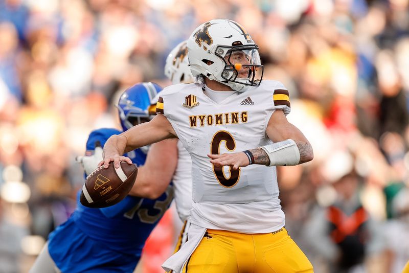 Oct 14, 2023; Colorado Springs, Colorado, USA; Wyoming Cowboys quarterback Andrew Peasley (6) looks to pass in the first quarter against the Air Force Falcons at Falcon Stadium. Mandatory Credit: Isaiah J. Downing-USA TODAY Sports