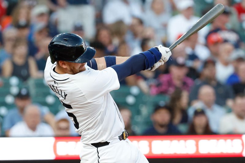 Jun 24, 2024; Detroit, Michigan, USA;  Detroit Tigers catcher Carson Kelly (15) hits an RBI single in the fifth inning against the Philadelphia Phillies at Comerica Park. Mandatory Credit: Rick Osentoski-USA TODAY Sports