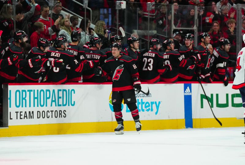 Apr 5, 2024; Raleigh, North Carolina, USA; Carolina Hurricanes center Jake Guentzel (59) celebrates his goal against the Washington Capitals during the second period at PNC Arena. Mandatory Credit: James Guillory-USA TODAY Sports