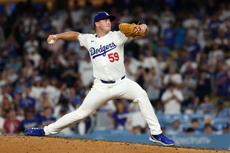 Jul 5, 2024; Los Angeles, California, USA;  Los Angeles Dodgers relief pitcher Evan Phillips (59) pitches during the ninth inning against the Milwaukee Brewers at Dodger Stadium. Mandatory Credit: Kiyoshi Mio-USA TODAY Sports