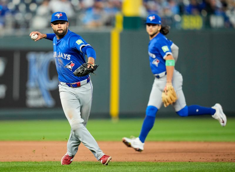 Apr 23, 2024; Kansas City, Missouri, USA; Toronto Blue Jays third base Isiah Kiner-Falefa (7) throws to first base during the fifth inning against the Kansas City Royals at Kauffman Stadium. Mandatory Credit: Jay Biggerstaff-USA TODAY Sports