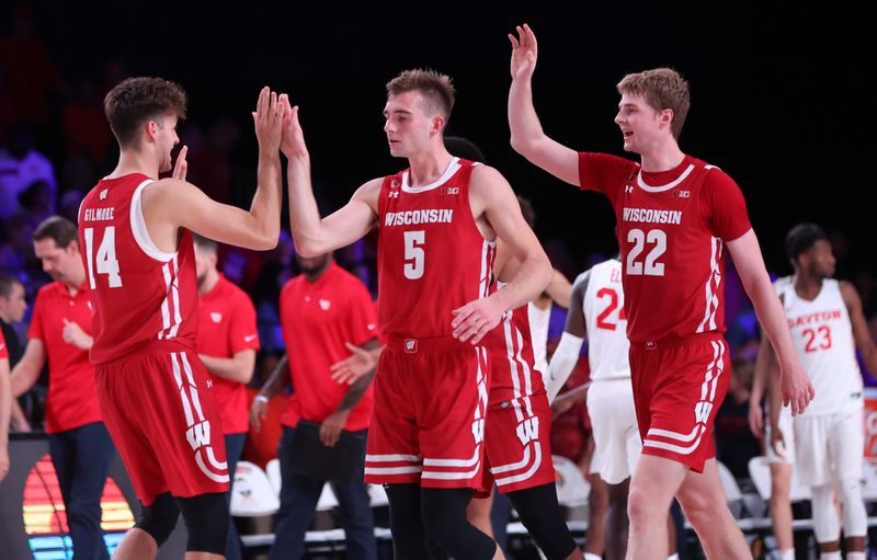 Nov 23, 2022; Paradise Island, BAHAMAS; Wisconsin Badgers forward Carter Gilmore (14) and Wisconsin Badgers forward Tyler Wahl (5) and Wisconsin Badgers forward Steven Crowl (22) celebrate after the game against the Dayton Flyers at Imperial Arena. Mandatory Credit: Kevin Jairaj-USA TODAY Sports