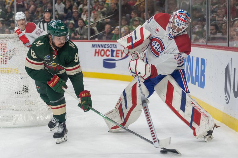 Dec 21, 2023; Saint Paul, Minnesota, USA; Minnesota Wild left wing Marcus Johansson (90) steals the puck behind the net from Montreal Canadiens goaltender Sam Montembeault (35) in the first period at Xcel Energy Center. Mandatory Credit: Matt Blewett-USA TODAY Sports