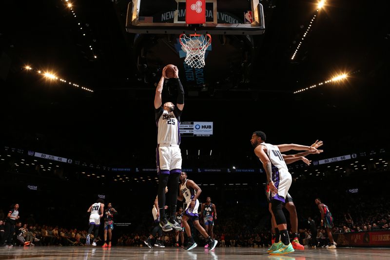 BROOKLYN, NY - APRIL 7: Alex Len #25 of the Sacramento Kings grabs a rebound during the game against the Brooklyn Nets on April 7, 2024 at Barclays Center in Brooklyn, New York. NOTE TO USER: User expressly acknowledges and agrees that, by downloading and or using this Photograph, user is consenting to the terms and conditions of the Getty Images License Agreement. Mandatory Copyright Notice: Copyright 2024 NBAE (Photo by Nathaniel S. Butler/NBAE via Getty Images)