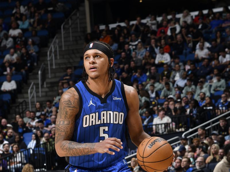 ORLANDO, FL - FEBRUARY 29: Paolo Banchero #5 of the Orlando Magic handles the ball during the game against the Utah Jazz on February 29, 2024 at Amway Center in Orlando, Florida. NOTE TO USER: User expressly acknowledges and agrees that, by downloading and or using this photograph, User is consenting to the terms and conditions of the Getty Images License Agreement. Mandatory Copyright Notice: Copyright 2024 NBAE (Photo by Fernando Medina/NBAE via Getty Images)