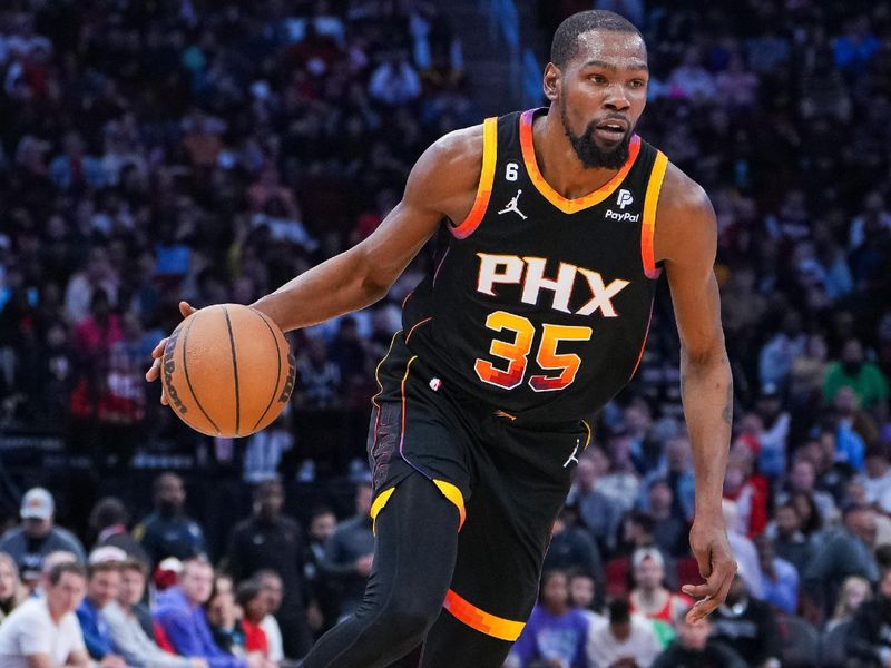 HOUSTON, TEXAS - DECEMBER 27: Kevin Durant #35 of the Phoenix Suns dribbles the ball in the second quarter of the game against the Houston Rockets at Toyota Center on December 27, 2023 in Houston, Texas. User expressly acknowledges and agrees that, by downloading and or using this photograph, User is consenting to the terms and conditions of the Getty Images License Agreement. (Photo by Alex Bierens de Haan/Getty Images)